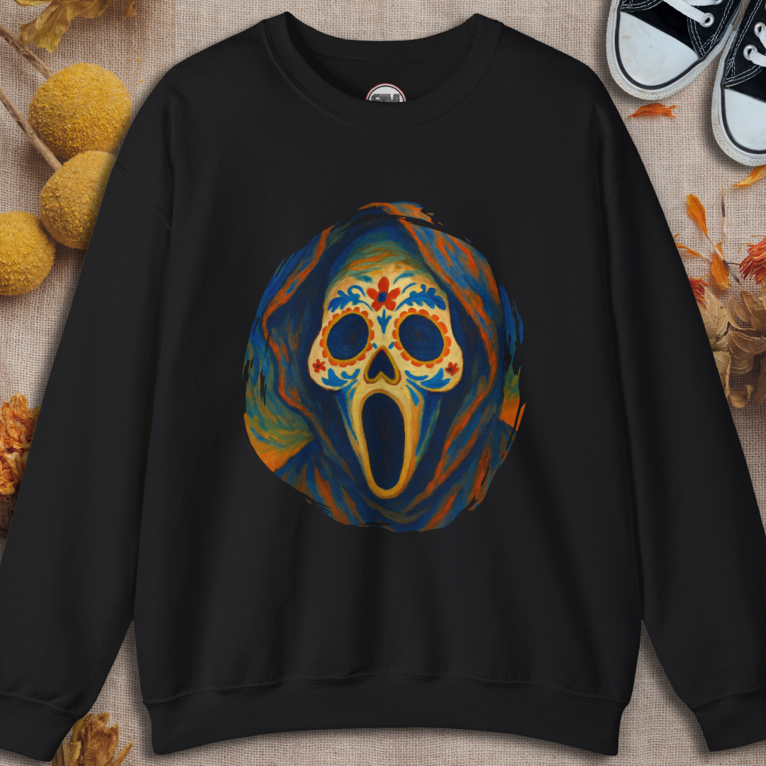 Black sweatshirt with a colorful ghost face sugar skull design on a textured surface.