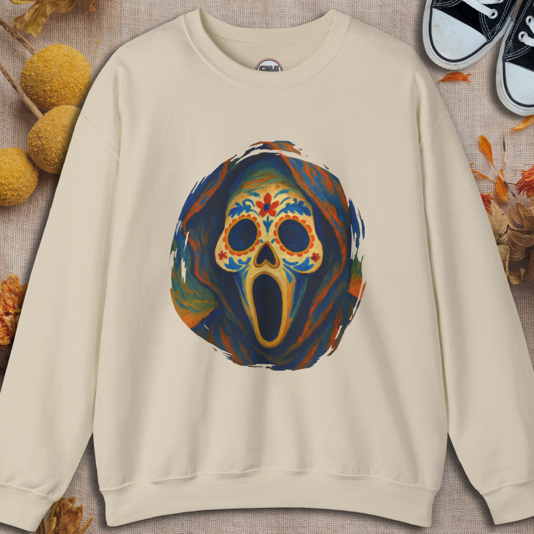 Sand sweatshirt with a colorful ghost face sugar skull design on a textured surface.