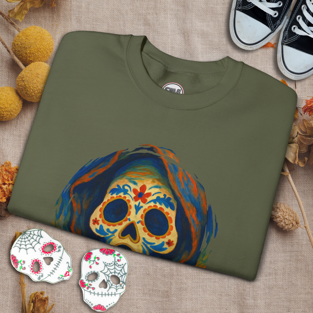 Green sweatshirt with a colorful ghost face sugar skull design on a textured surface.