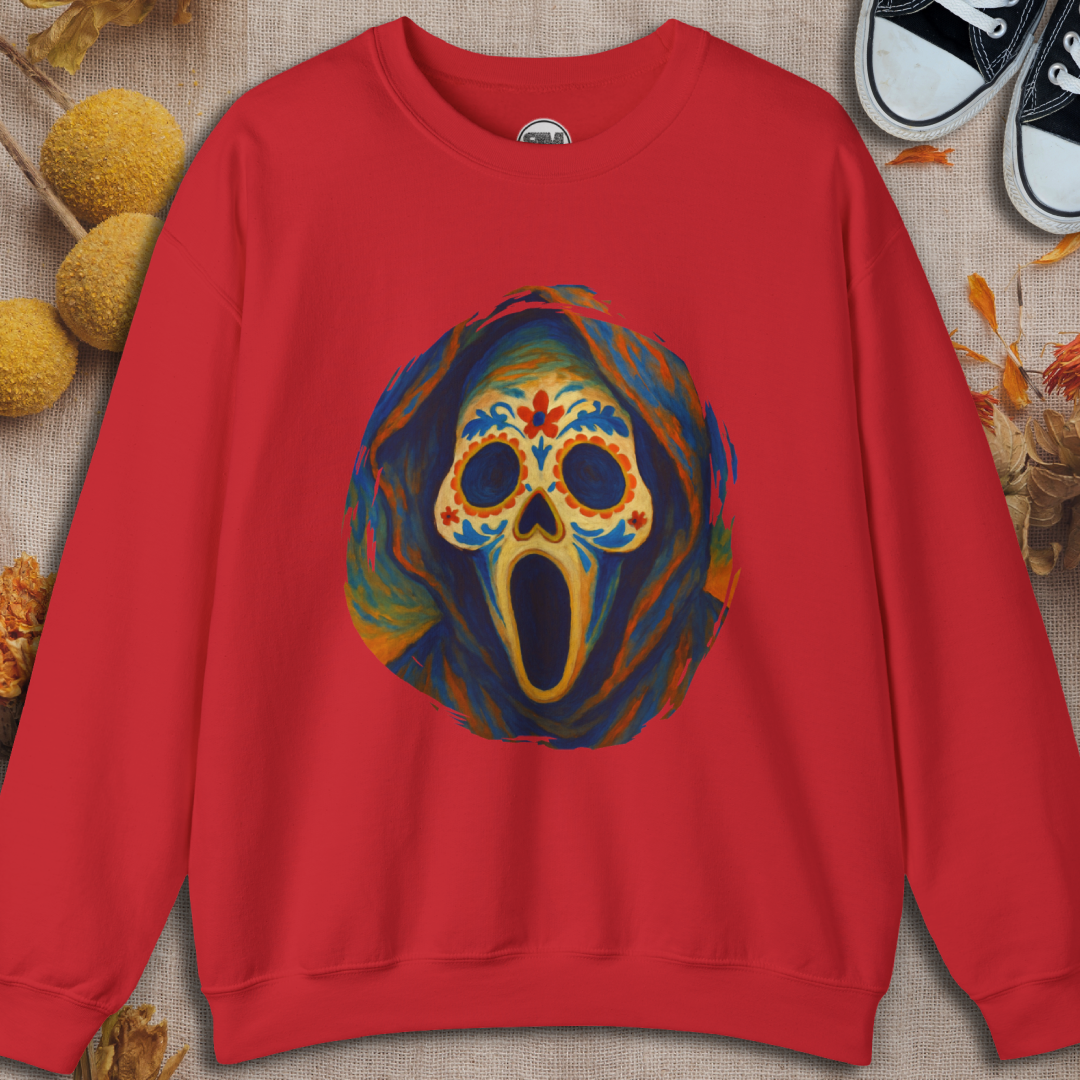 Red sweatshirt with a colorful ghost face sugar skull design on a textured surface.