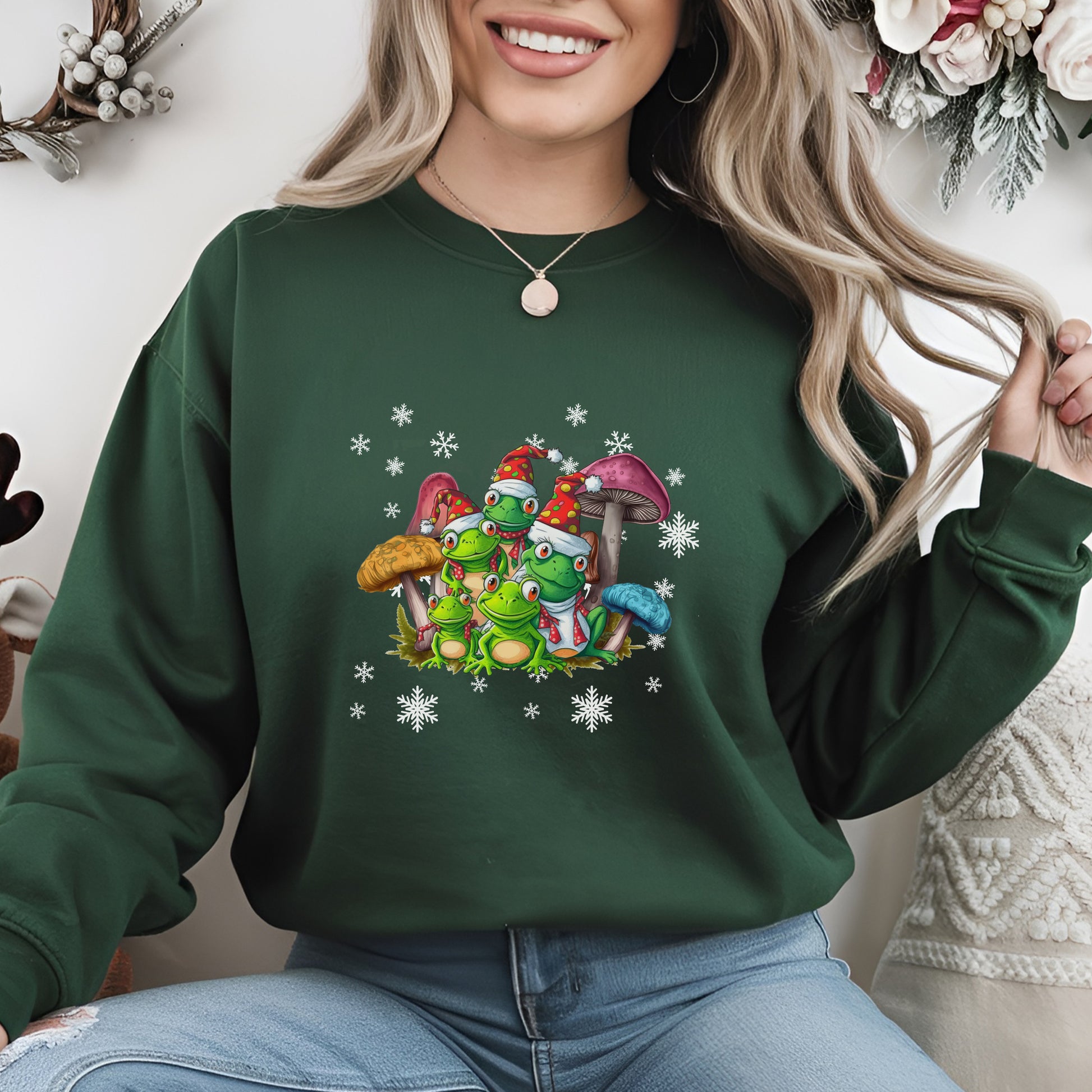 Person wearing a green sweatshirt with cartoon characters and mushrooms design.