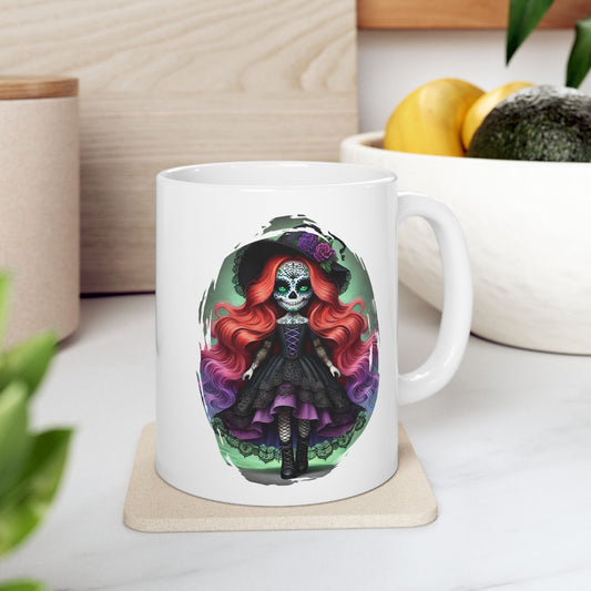 White mug with a colorful sugar skull calavera doll design on a white surface